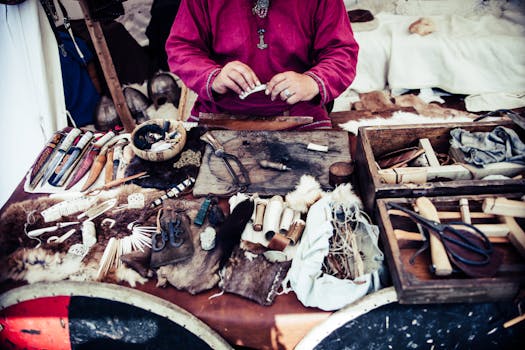 Artisan crafting tools and materials in a traditional workshop setting.